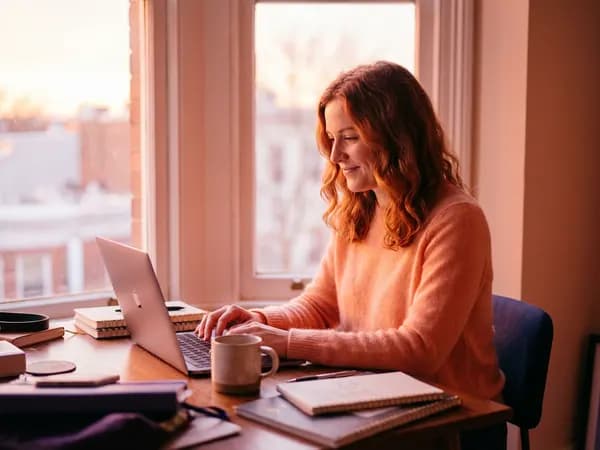 Entering a birth date on a laptop in morning light